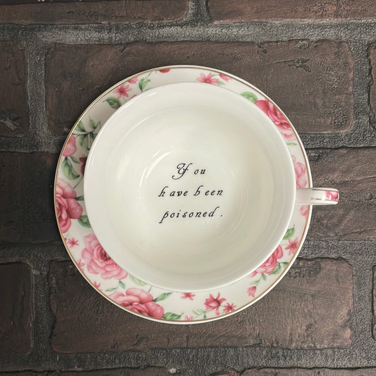You've been Poisoned Tea Cup & Bye Saucer, White and pink Rose Floral Pattern
