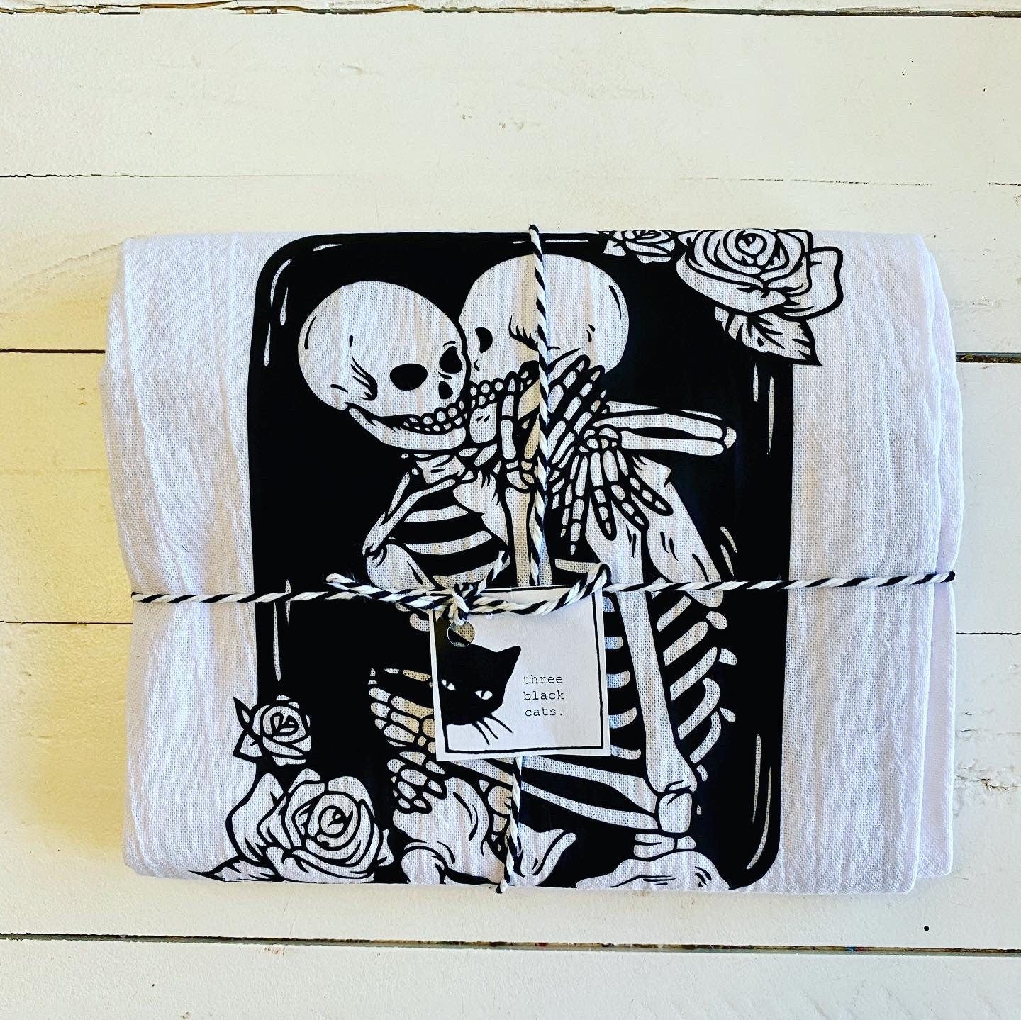 Forever Yours, embracing skeletons Tea towel