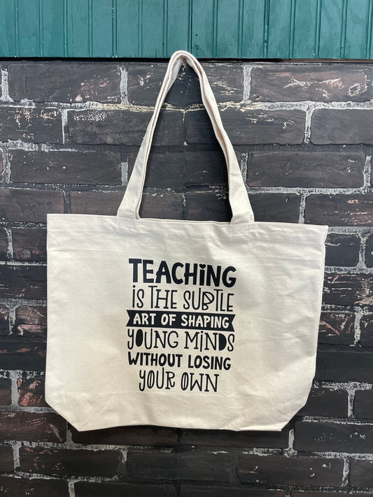 Teaching is the subtle art of teaching young minds without losing your own, Tote Bag