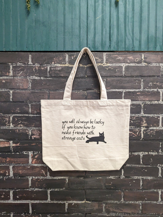 You will always be lucky if you know how to make friends with strange cats, Tote Bag