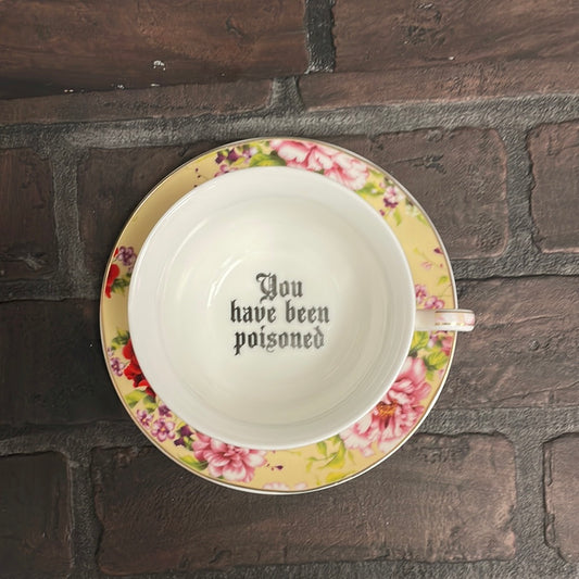 You’ve been poisoned, Tea cup and saucer, Yellow and Red Floral - Three Black Cats
